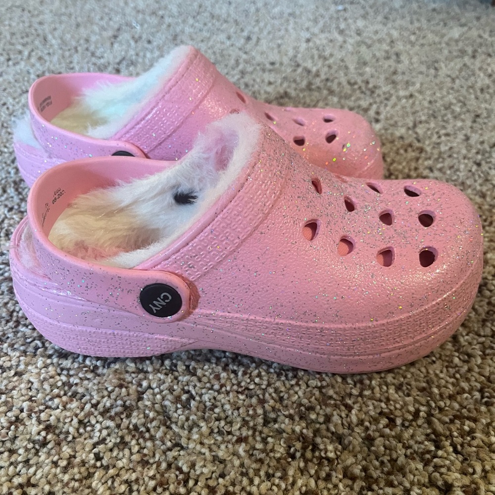 Pink glittery Croc style girls shoes with fuzzy inside.